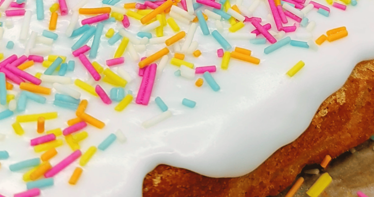 school cake: a soft vanilla sponge, topped with a thick white icing, and colourful sprinkles